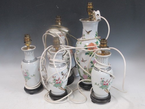 Lot 60 - Three similar modern ceramic lamps decorated...