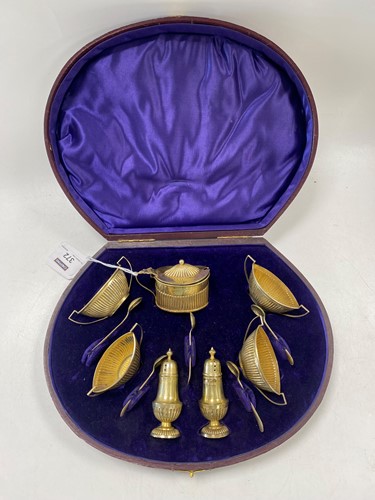 Lot 372 - A cased silver gilt 7-piece cruet set,...