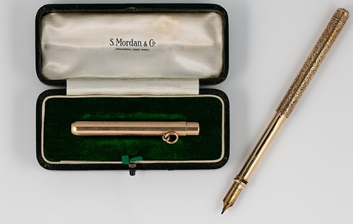 Lot 244 - A 15ct gold drop pencil holder, mark of Sampson Mordan & Company, together with another example