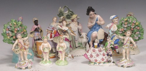 Lot 206 - A collection of porcelain figures including a...