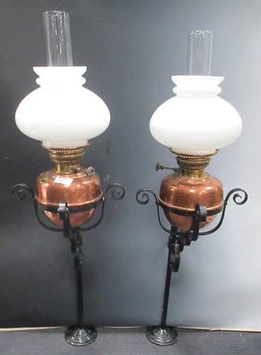 Lot 159 - A pair of Veritas copper and brass oil lamps,...
