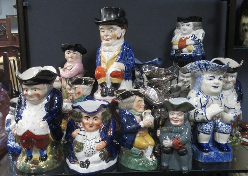 Lot 120 - A collection of Victorian and later Toby Jugs...