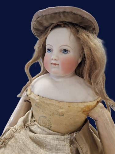 Lot 50 - An Adelaide Huret bisque shoulder head fashion doll with accessories