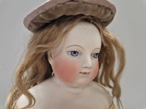 Lot 50 - An Adelaide Huret bisque shoulder head fashion doll with accessories
