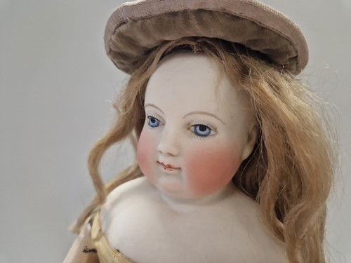 Lot 50 - An Adelaide Huret bisque shoulder head fashion doll with accessories