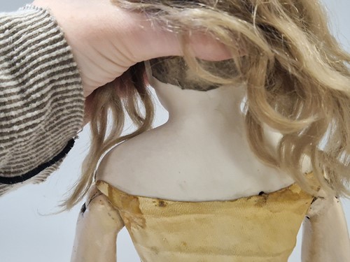 Lot 50 - An Adelaide Huret bisque shoulder head fashion doll with accessories