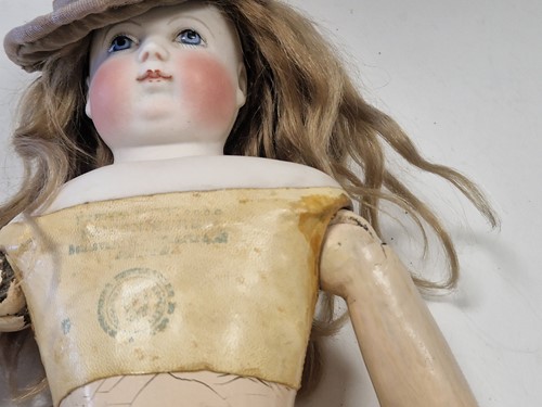Lot 50 - An Adelaide Huret bisque shoulder head fashion doll with accessories