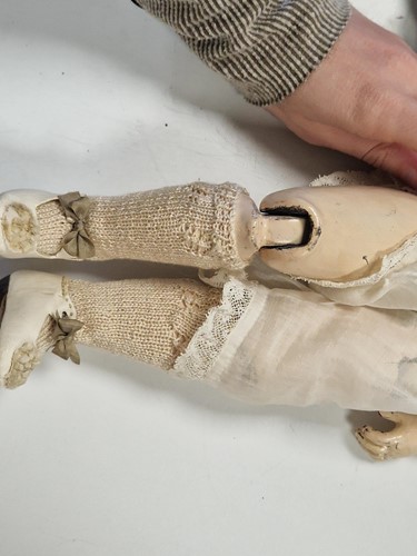 Lot 50 - An Adelaide Huret bisque shoulder head fashion doll with accessories