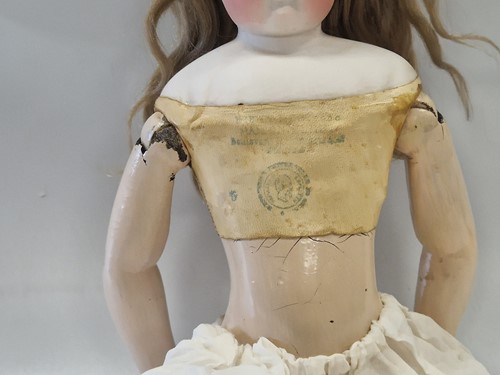 Lot 50 - An Adelaide Huret bisque shoulder head fashion doll with accessories