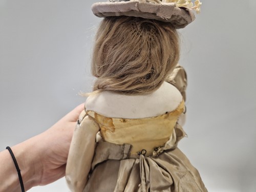 Lot 50 - An Adelaide Huret bisque shoulder head fashion doll with accessories