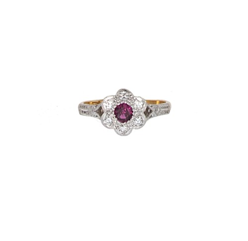 Lot 68 - A ruby and diamond daisy style cluster ring