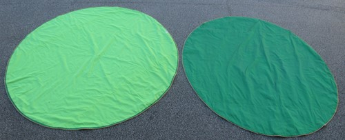 Lot 282 - Two modern circular emerald green silk...