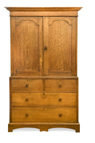 Lot 256 - In the manner of Heal & Son, an Arts & Crafts oak linen press