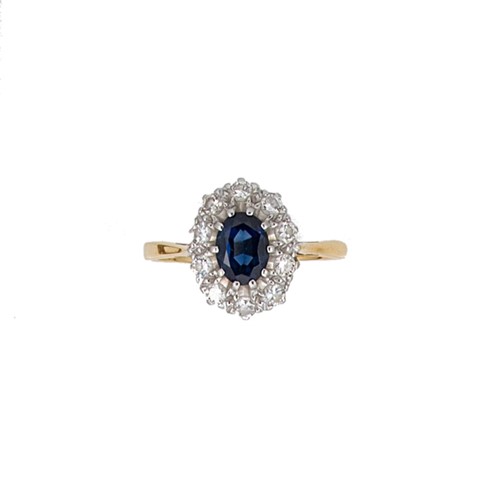Lot 101 - A sapphire and diamond cluster ring