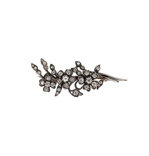 Lot 104 - A diamond set floral spray brooch