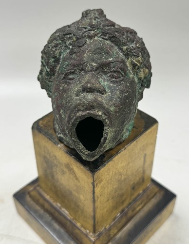 Lot 560 - A Roman bronze lamp, probably circa 100 AD