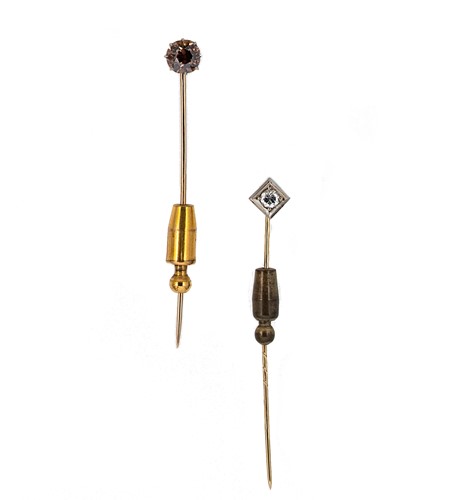Lot 82 - Two diamond set stick pins