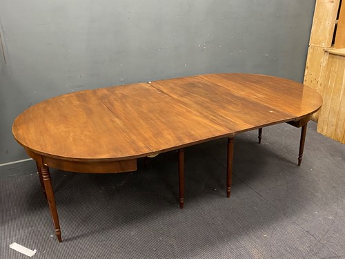 Lot 493 - A Regency D-end mahogany dining table, on 8...