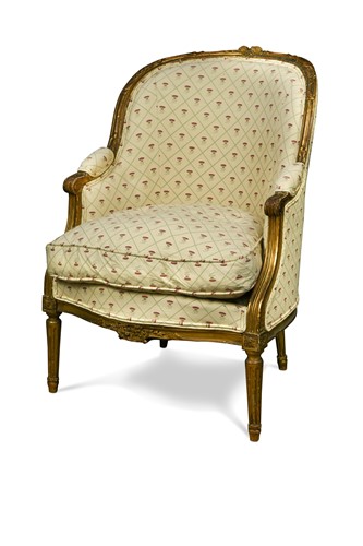 Lot 545 - A French Louis XVI style giltwood bergère armchair, 19th century