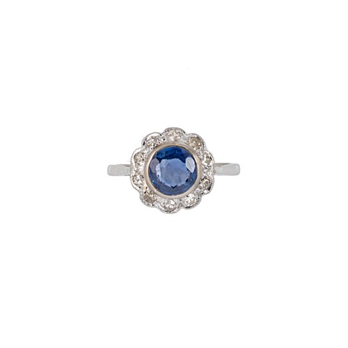 Lot 150 - A Burmese sapphire and diamond cluster ring