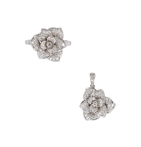 Lot 106 - An 18ct gold diamond set flower ring together with a matching pendant