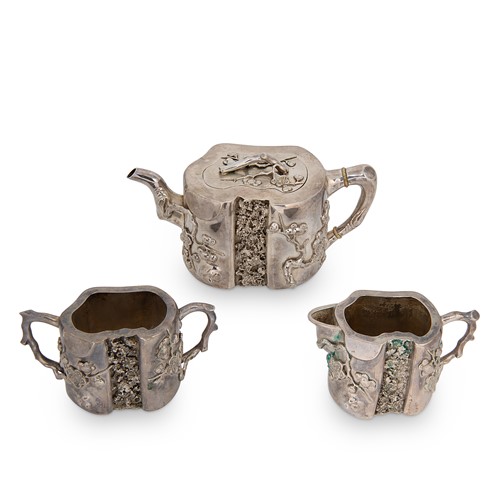 Lot 274 - A late 19th / early 20th century Chinese export metalwares three-piece tea set