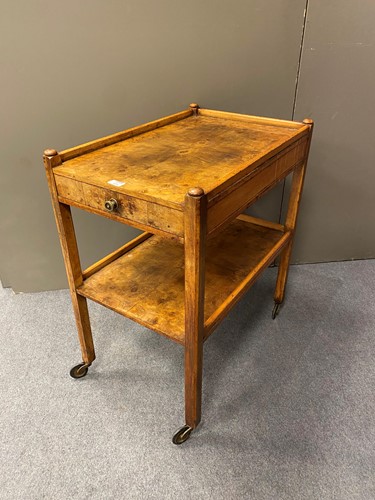 Lot 437 - A figured walnut two tier tea trolley, 79cm x...