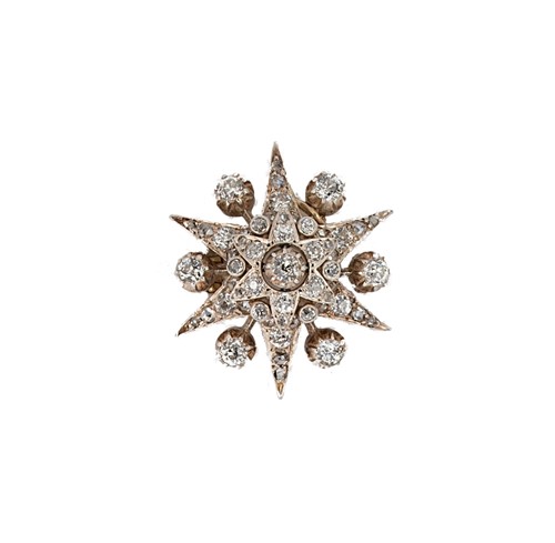 Lot 126 - An early 20th century diamond set star brooch