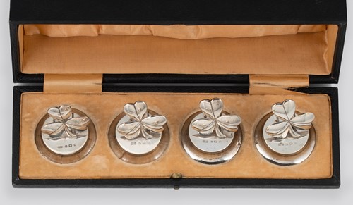 Lot 258 - A cased set of four George V silver novelty menu holders