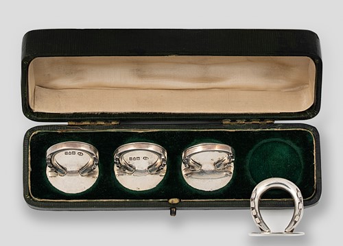Lot 232 - A cased set of four Edward VII silver novelty menu holders