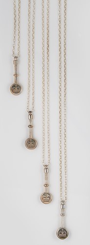 Lot 252 - A set of four Elizabeth II silver napkin clips