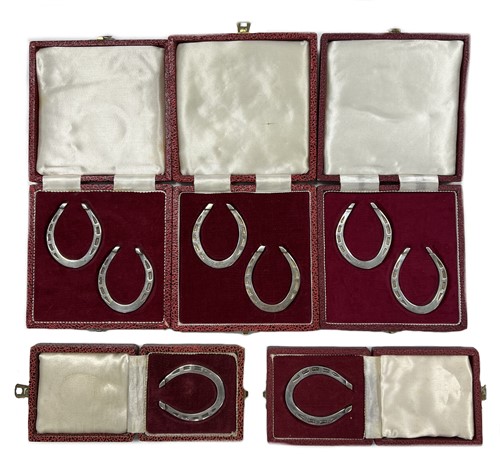 Lot 226 - A collection of eight Elizabeth II silver novelty napkin rings