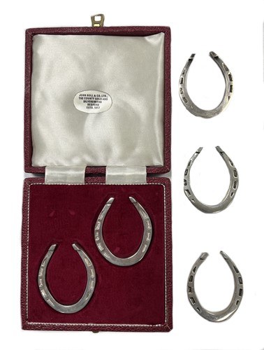 Lot 227 - A collection of five Elizabeth II silver novelty napkin rings