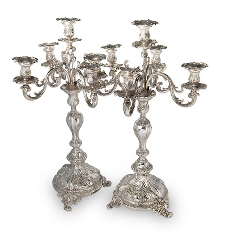 Lot 282 - A pair of German metalwares silver five light candelabra
