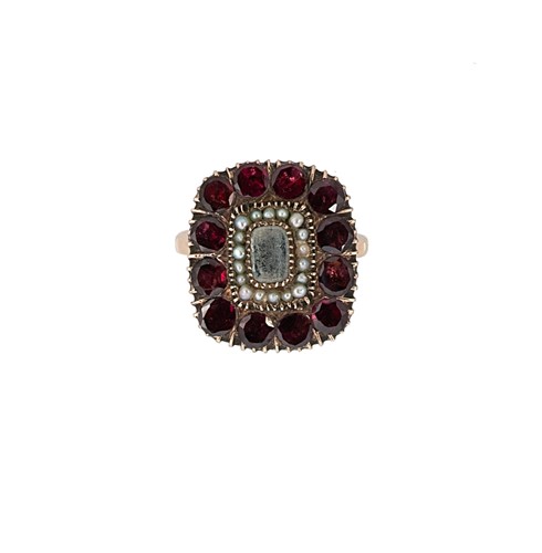 Lot 121 - A garnet and pearl dress ring