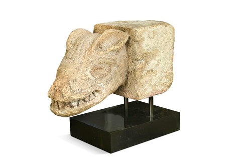Lot 256 - A carved stone wolf head gargoyle
