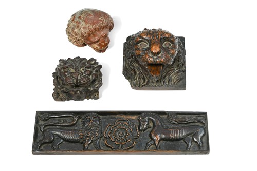 Lot 264 - A collection of three carved wood lion heads, probably 19th century