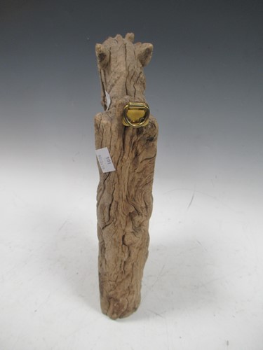 Lot 23 - A carved wood fragment of an Indian war horse...