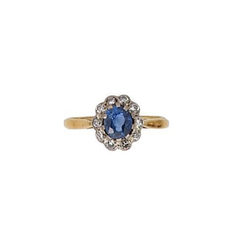 Lot 102 - A late 20th century 18ct gold sapphire and diamond cluster ring