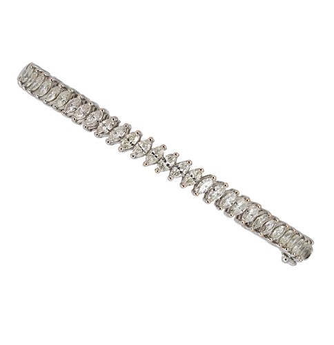 Lot 143 - A diamond set bangle