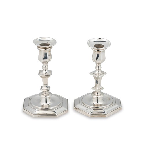 Lot 324 - A visual pair of George V silver candlesticks