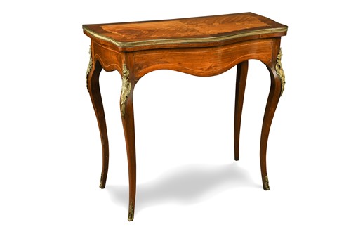 Lot 557 - A Louis XV style serpentine satinwood fold-over card table, 19th century