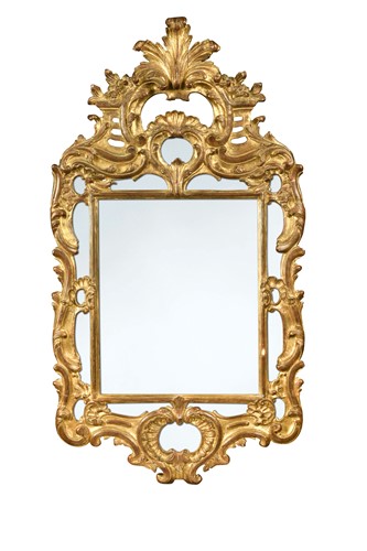 Lot 298 - A Continental baroque style carved giltwood and gesso wall mirror