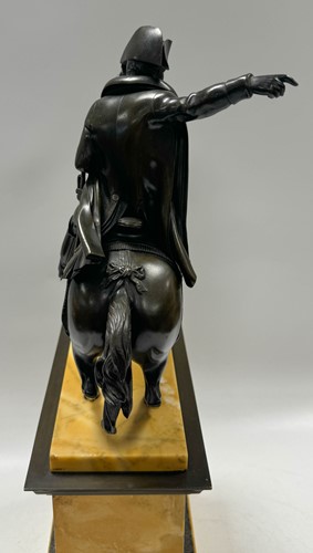 Lot 515 - A patinated bronze model of Napoleon on horseback, late 19th century