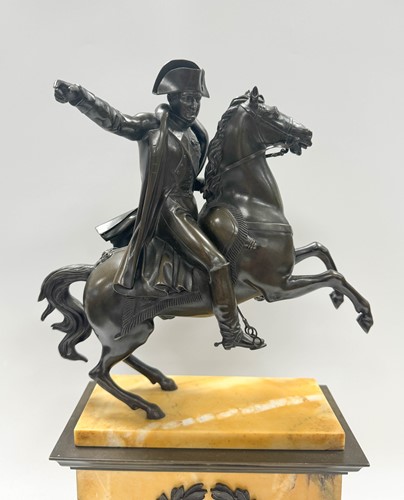 Lot 515 - A patinated bronze model of Napoleon on horseback, late 19th century