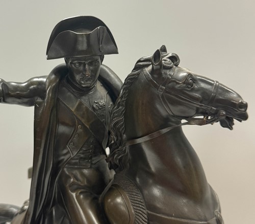 Lot 515 - A patinated bronze model of Napoleon on horseback, late 19th century