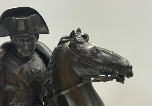 Lot 515 - A patinated bronze model of Napoleon on horseback, late 19th century