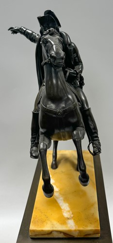 Lot 515 - A patinated bronze model of Napoleon on horseback, late 19th century
