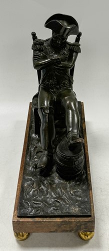 Lot 529 - A bronze model of the recumbent Napoleon resting his foot on a barrel, French School, 19th century