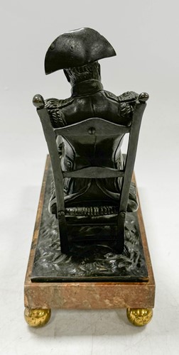 Lot 529 - A bronze model of the recumbent Napoleon resting his foot on a barrel, French School, 19th century